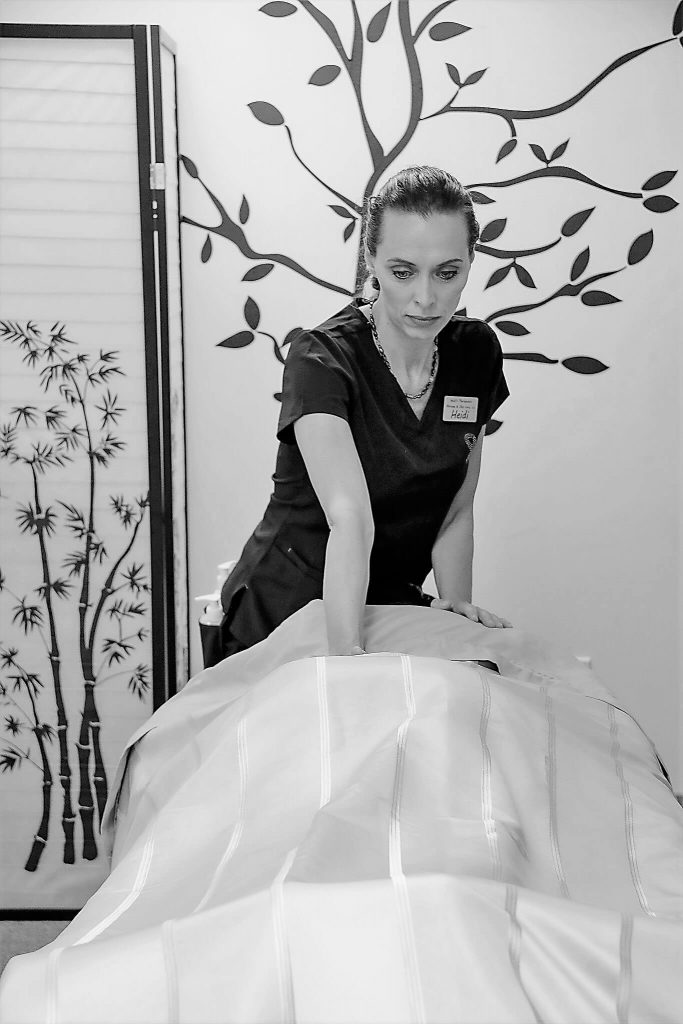 Heidi performing a therapeutic massage